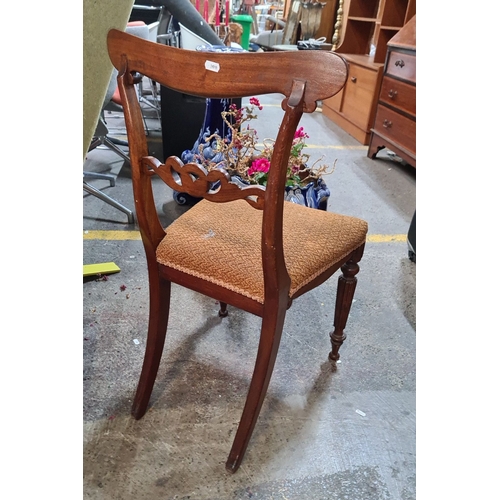 435 - A very handsome 19th-century Victorian mahogany side chair features intricately carved back and upho... 