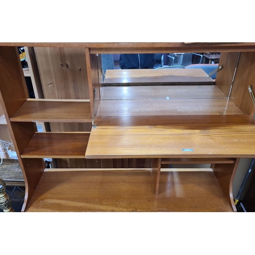 440 - Star Lot : Mid-century teak modular shelving unit with integrated drop-front bar compartment. Elegan... 