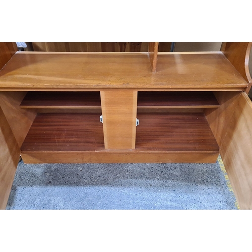 440 - Star Lot : Mid-century teak modular shelving unit with integrated drop-front bar compartment. Elegan... 