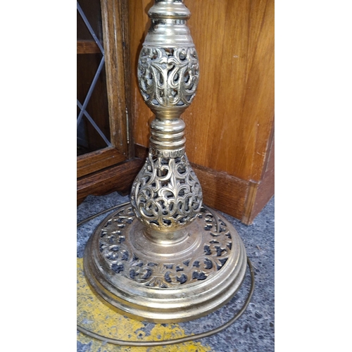 443 - Ornate brass floor lamp, vintage design featuring intricate scrollwork.