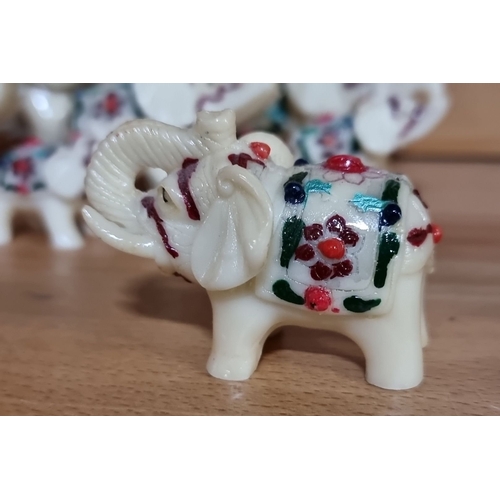 487 - Hand-painted ceramic elephant figurines feature vibrant floral motifs, set of six. They have unique ... 