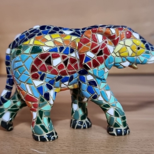 489 - Elephant figurine collection features mosaic designs and includes glass, stone, and brass pieces.