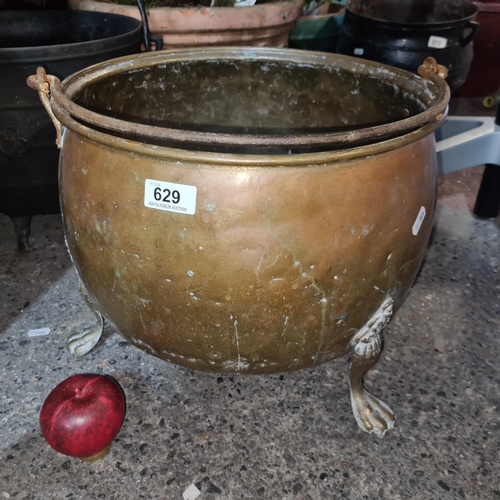 629 - Star Lot : A super large georhaim solid copper cauldron. Features claw feet and with  swing handle. ... 