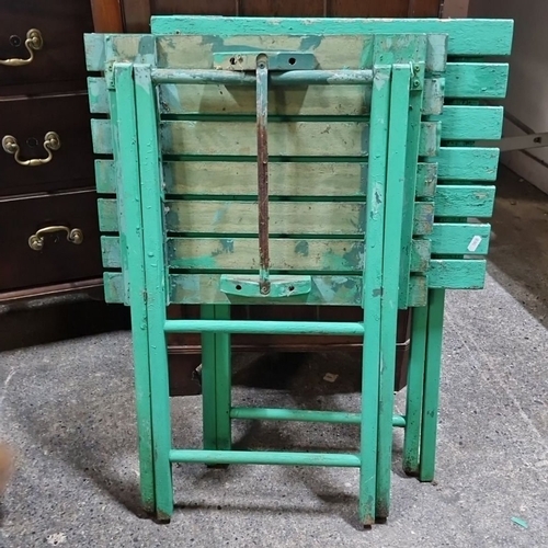 801 - Pair of vintage green folding wooden tables with a weathered finish.