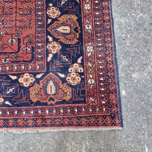 810 - Star Lot : Vibrant handmade, hand knotted Persian rug, mid-20th century, intricate geometric motifs,... 