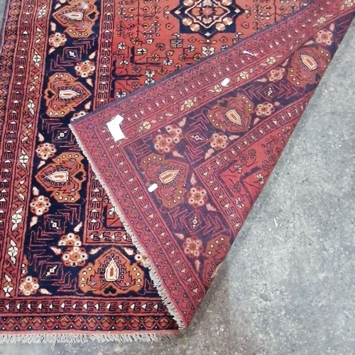 810 - Star Lot : Vibrant handmade, hand knotted Persian rug, mid-20th century, intricate geometric motifs,... 