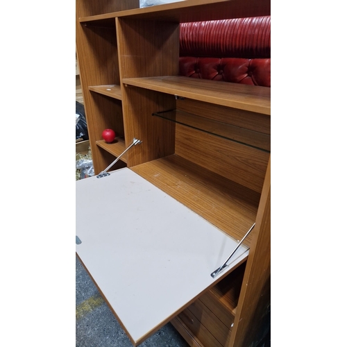 828 - Star Lot : A Mid-century modern wall unit, featuring adjustable shelving and drop-down drinks cabine... 