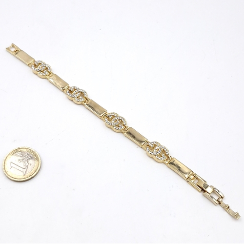 537 - A gold metal gem set bracelet. Item as per photographed. Weight - 24.53 grams.