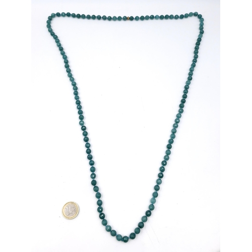 574 - A super long natural Emerald necklace. Length - 108 cms. Total weight - 91.4 grams. Stones cold to t... 