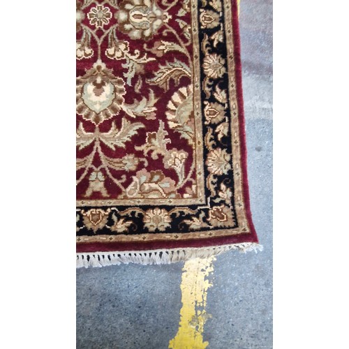 344 - A good warm wool hall runner, On red ground with cream and black detail. 
MM: 321cm X 79cm