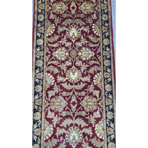 344 - A good warm wool hall runner, On red ground with cream and black detail. 
MM: 321cm X 79cm