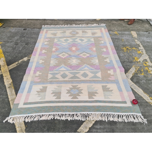 951 - A lovely Afghan Kilim floor in soft pastel colours. All hand knotted, will hold up to wear and retai... 