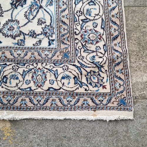 949 - Large Handwoven vintage Persian wool rug with blue floral design on cream background. Originally ret... 