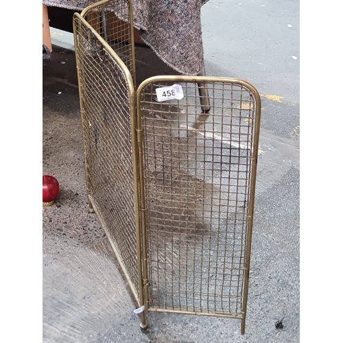 986 - An Antique brass mesh folding, 3 part fire screen. Measures approximately 24 inches tall and 36 inch... 