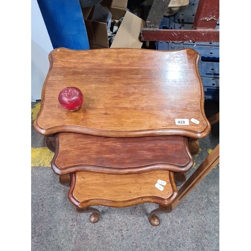 991 - Set of three nested wooden tables, from the mid-20th century, featuring carved cabriole legs. Larges... 