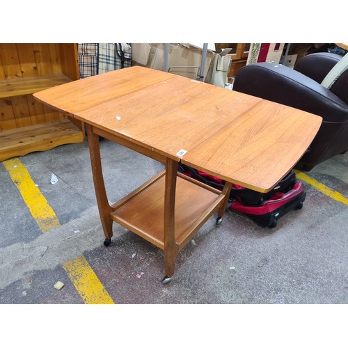 1005 - Star Lot : A fabulous teak mid century drop leaf hostess trolley with shelf beneath with lovely curv... 