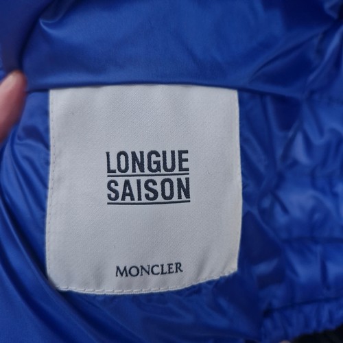 338 - A 'Longue Saison Moncler' blue short down jacket. Features pockets. Model no. G19541A12920 In very g... 