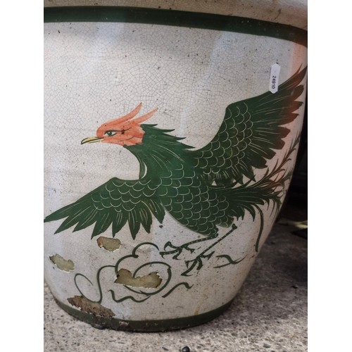 620 - A ceramic plant pot with Chinese style bird motif.