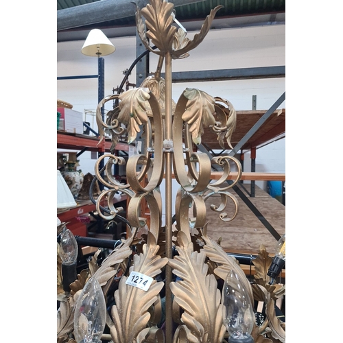 1112 - Star Lot : A fabulous large Ornate gold-tone 8 branch chandelier featuring intricate leaf and scroll... 