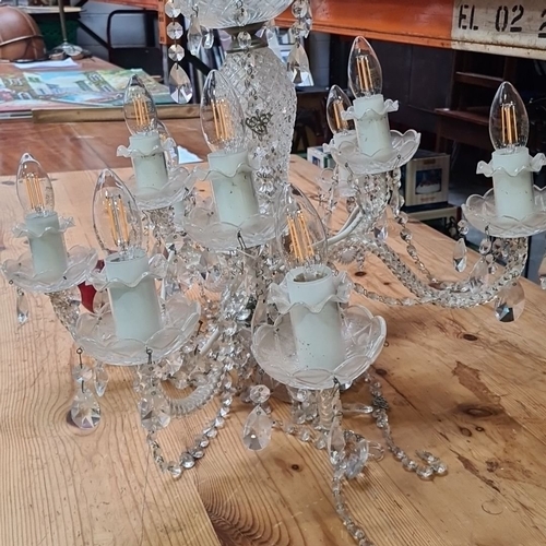 1114 - Star Lot : A large Vintage crystal chandelier with 10 arms and decorative faceted crystal drops, fea... 