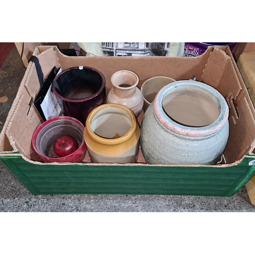 1135 - Mixed lot of studio pottery vases and containers in various styles and glazes, including stoneware a... 