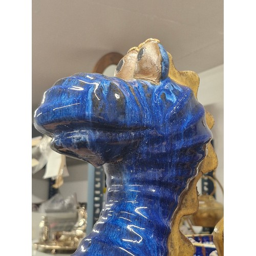 195 - A large brilliant blue glazed, ceramic Loch Ness Monster. Comes in three pieces which can be display... 