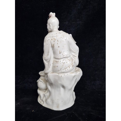 231 - Star Lot : A super vintage Blanc de Chine ceramic figurine / sculpture. Features a seated traditiona... 