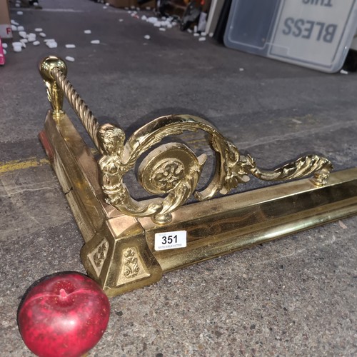 351 - A gorgeous solid brass extendable fire fender featuring scroll and barley twist detail, with finial ... 