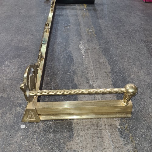 351 - A gorgeous solid brass extendable fire fender featuring scroll and barley twist detail, with finial ... 