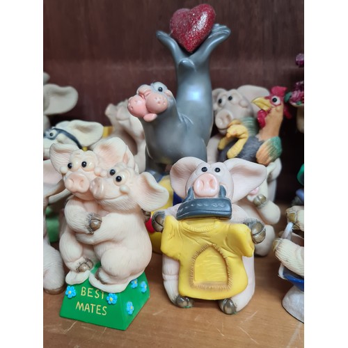 725 - A super large collection of over 30 Piggin' figurines. Featuring cheerful pigs in many humorous situ... 