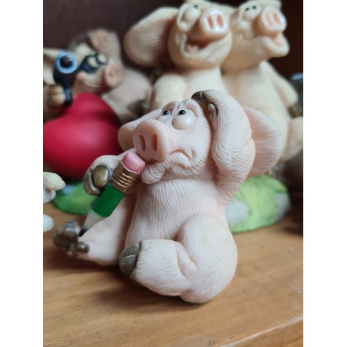 725 - A super large collection of over 30 Piggin' figurines. Featuring cheerful pigs in many humorous situ... 