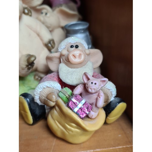 725 - A super large collection of over 30 Piggin' figurines. Featuring cheerful pigs in many humorous situ... 