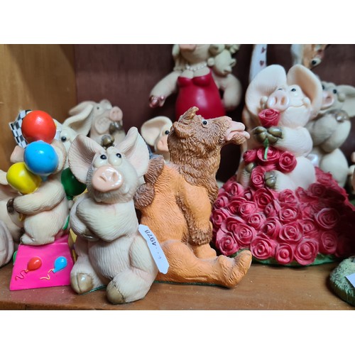 725 - A super large collection of over 30 Piggin' figurines. Featuring cheerful pigs in many humorous situ... 