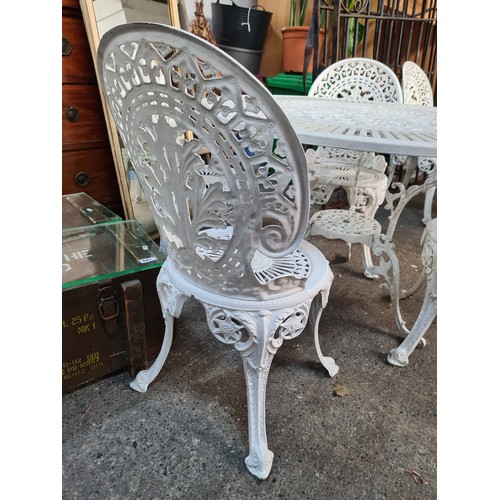 639 - Star Lot : A fabulous  metal garden patio set. Features table and four matching chairs. In an off wh... 