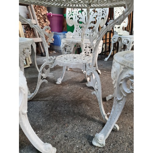 639 - Star Lot : A fabulous  metal garden patio set. Features table and four matching chairs. In an off wh... 