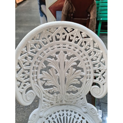 639 - Star Lot : A fabulous  metal garden patio set. Features table and four matching chairs. In an off wh... 