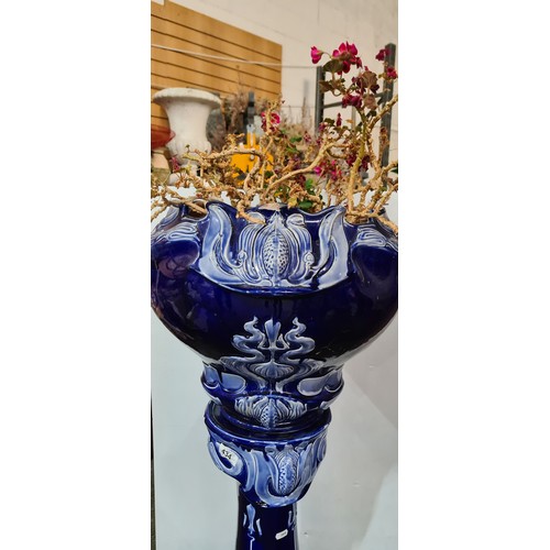 434 - Star Lot : A super large Art Nouveau Cobalt blue ceramic jardinière and pedestal, featuring intricat... 