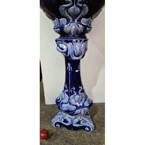 434 - Star Lot : A super large Art Nouveau Cobalt blue ceramic jardinière and pedestal, featuring intricat... 