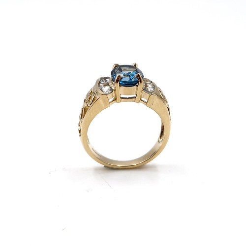 2 - Star lot : A nice example of a large blue topaz stone ring with gemset accents and lovely fretwork s... 