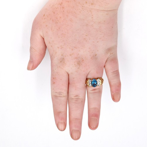 2 - Star lot : A nice example of a large blue topaz stone ring with gemset accents and lovely fretwork s... 