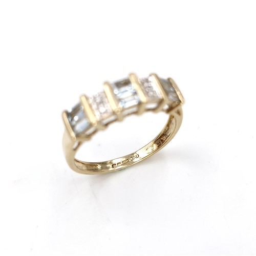 3 - Star lot : An aquamarine and diamond set ring in nine carat gold. Size - K 1/2. Weight - 2 grams.