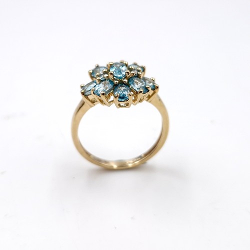 8 - Star lot : A nine carat gold topaz cluster ring. Size - L. Weight - 2.53 grams.