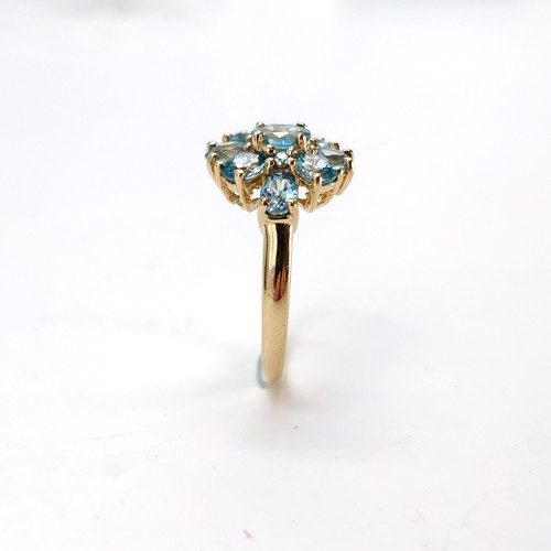 8 - Star lot : A nine carat gold topaz cluster ring. Size - L. Weight - 2.53 grams.