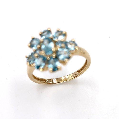 8 - Star lot : A nine carat gold topaz cluster ring. Size - L. Weight - 2.53 grams.