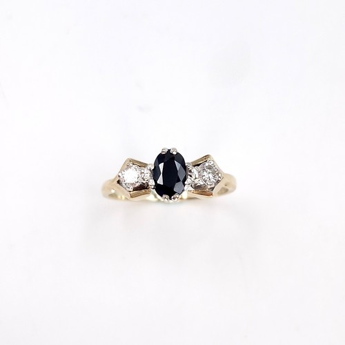 10 - Star lot : A sapphire and diamond ring set in nine carat gold. Size - K 1/2. Weight - 2.1 grams.