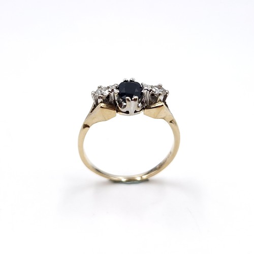 10 - Star lot : A sapphire and diamond ring set in nine carat gold. Size - K 1/2. Weight - 2.1 grams.