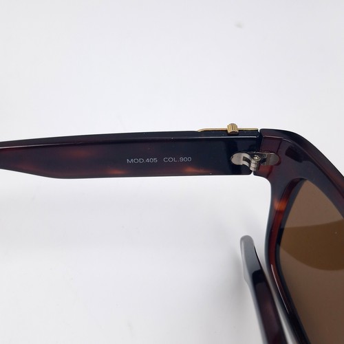 28 - A pair of Versace faux tortoise shell frame sunglasses.  Comes with certificate of authenticity & or... 