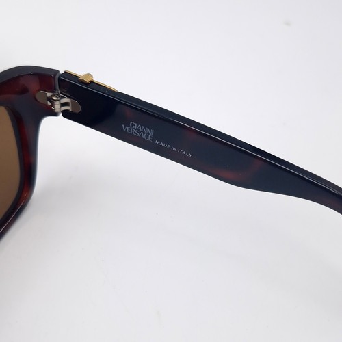 28 - A pair of Versace faux tortoise shell frame sunglasses.  Comes with certificate of authenticity & or... 