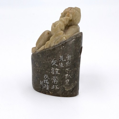 30 - A Chinese soapstone/nephrite carving with detail marks to base and side. Height - 7 cms. Total weigh... 