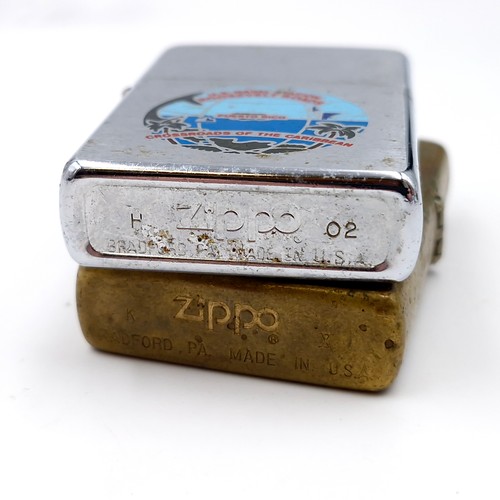 524 - Two military Zippo lighters - The first a brass example with mount displaying the word 'Illustrious'... 